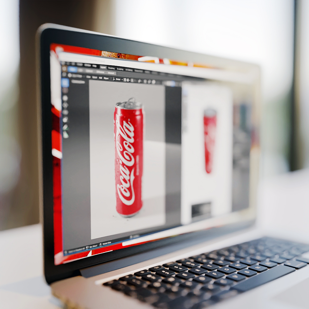 Ordinateur portable sur un bureau bland avec le logiciel Blender ouvert